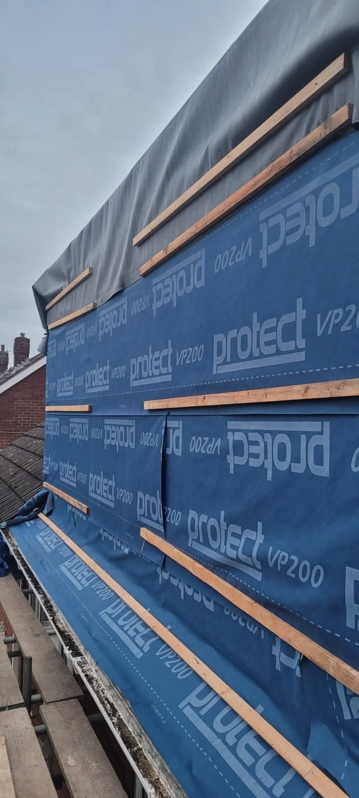 Breathable roofing membrane and timber battens fixed across the roof slope during the re-roof