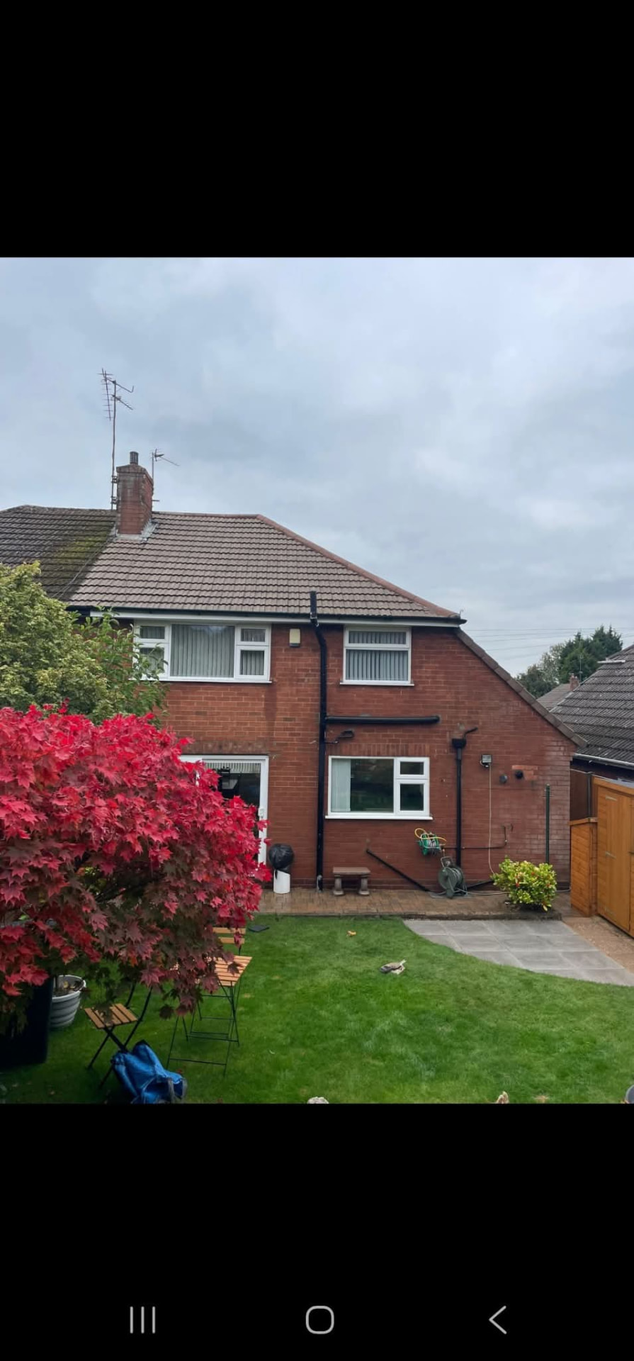 Completed garden transformation with new patio, lawn and fencing